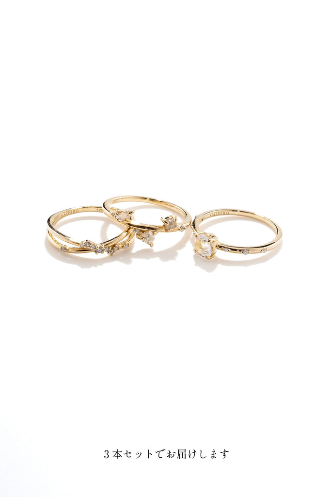 ジュエリースタジオMASHIROのカラーストーンアップサイクルジュエリー。レインボームーンストーン、天然ダイヤモンド、ダイヤモンド原石をセットしたシャンパンゴールドの重ね付けリング３本セット。