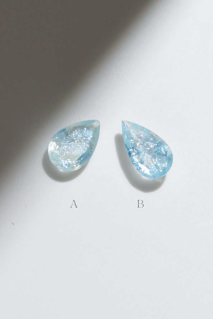 ジュエリースタジオMASHIROがお届けする宝石たち。ブラジル産のイリデッセンスアクアマリン。A：1.36ct（天の川）・1.36ct・9.5*6.8mm。B：1.27ct（銀河）・1.27ct・10.7*6.2mm。