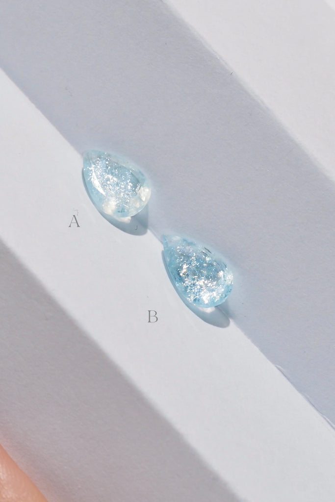 ジュエリースタジオMASHIROがお届けする宝石たち。ブラジル産のイリデッセンスアクアマリン。A：1.36ct（天の川）・1.36ct・9.5*6.8mm。B：1.27ct（銀河）・1.27ct・10.7*6.2mm。
