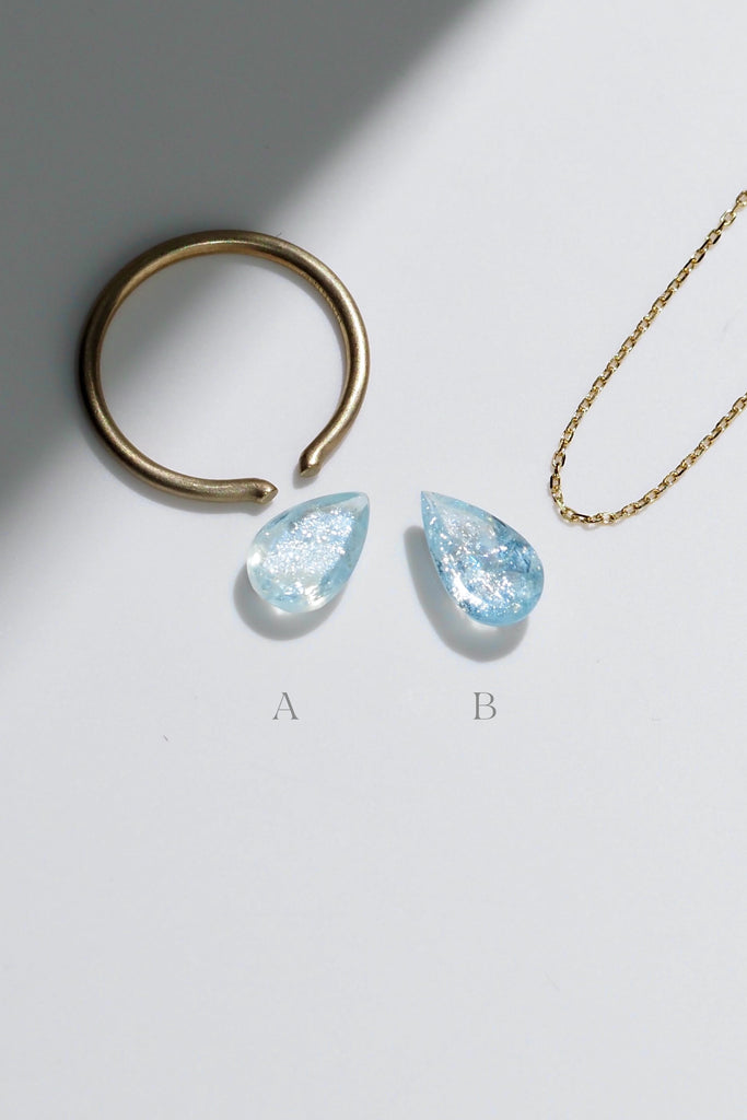 ジュエリースタジオMASHIROがお届けする宝石たち。ブラジル産のイリデッセンスアクアマリン。A：1.36ct（天の川）・1.36ct・9.5*6.8mm。B：1.27ct（銀河）・1.27ct・10.7*6.2mm。