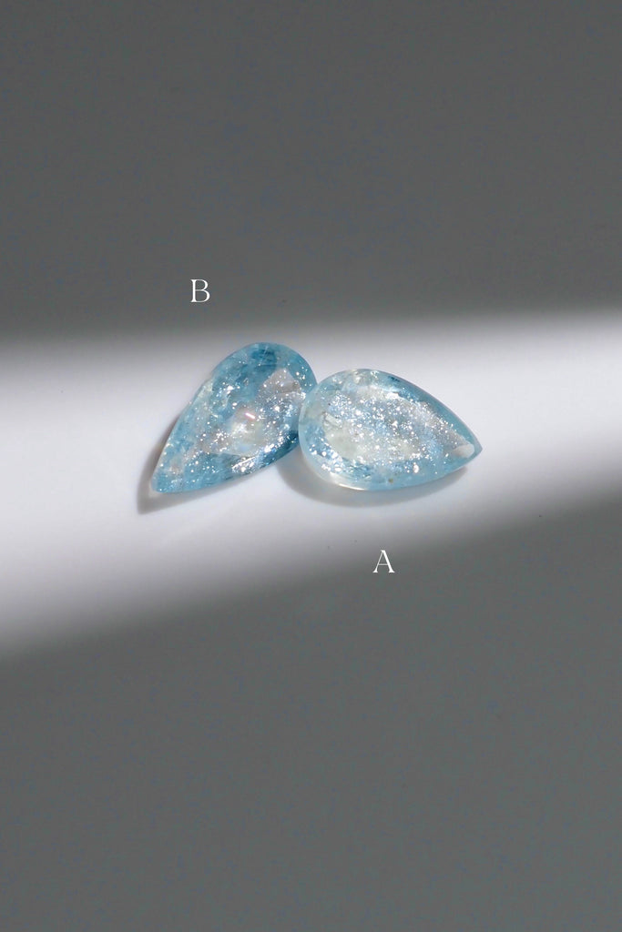 ジュエリースタジオMASHIROがお届けする宝石たち。ブラジル産のイリデッセンスアクアマリン。A：1.36ct（天の川）・1.36ct・9.5*6.8mm。B：1.27ct（銀河）・1.27ct・10.7*6.2mm。