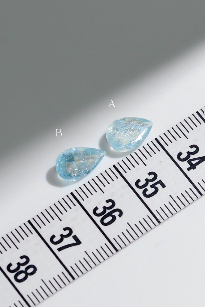 ジュエリースタジオMASHIROがお届けする宝石たち。ブラジル産のイリデッセンスアクアマリン。A：1.36ct（天の川）・1.36ct・9.5*6.8mm。B：1.27ct（銀河）・1.27ct・10.7*6.2mm。